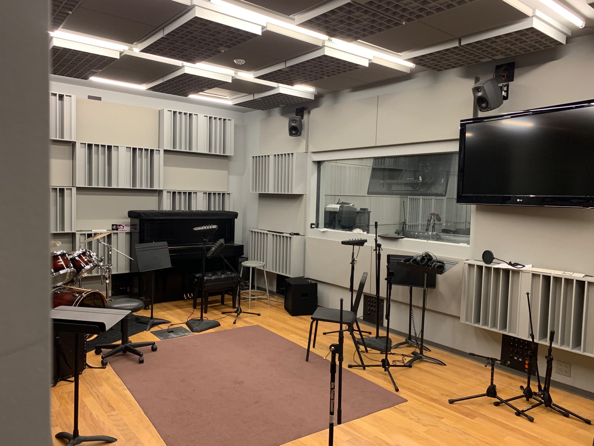 Recording live room with variable acoustics and isolated control-room sightline.