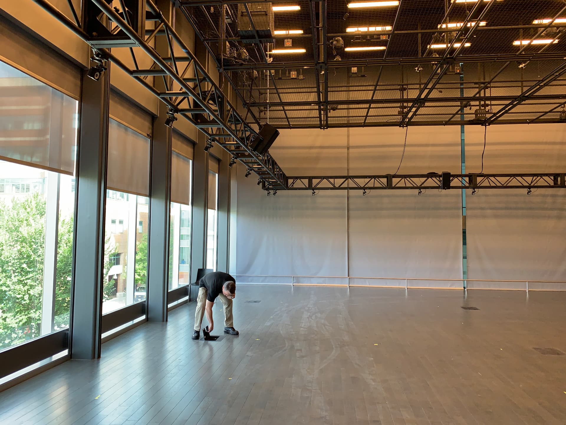 Multipurpose studio with perimeter truss, distributed loudspeakers, and floor pockets.