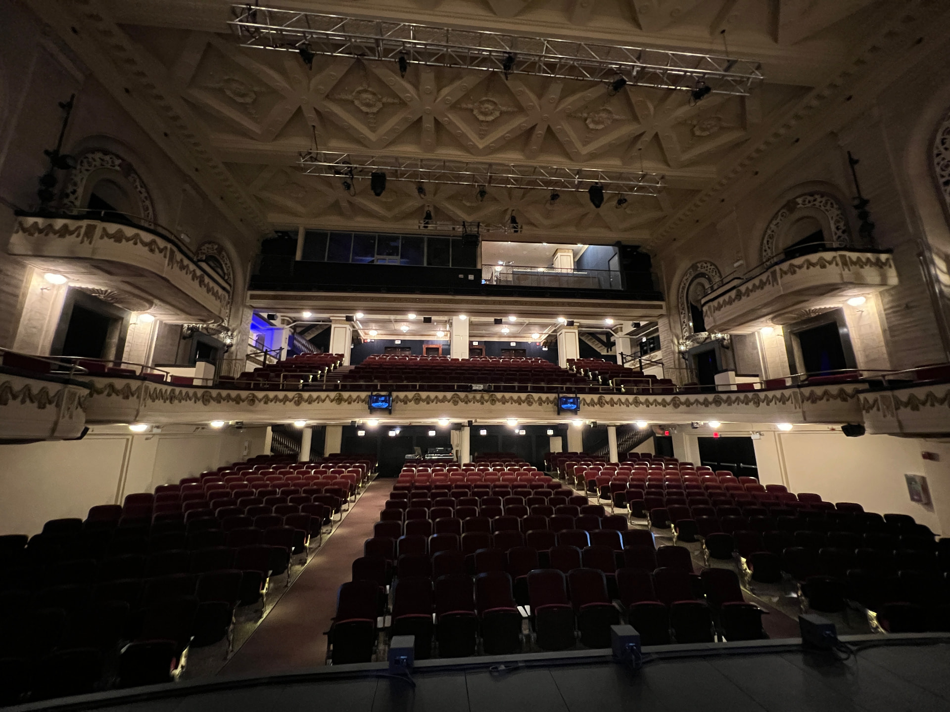 The restored house from the stage, with the rebuilt control room and balcony technical positions.