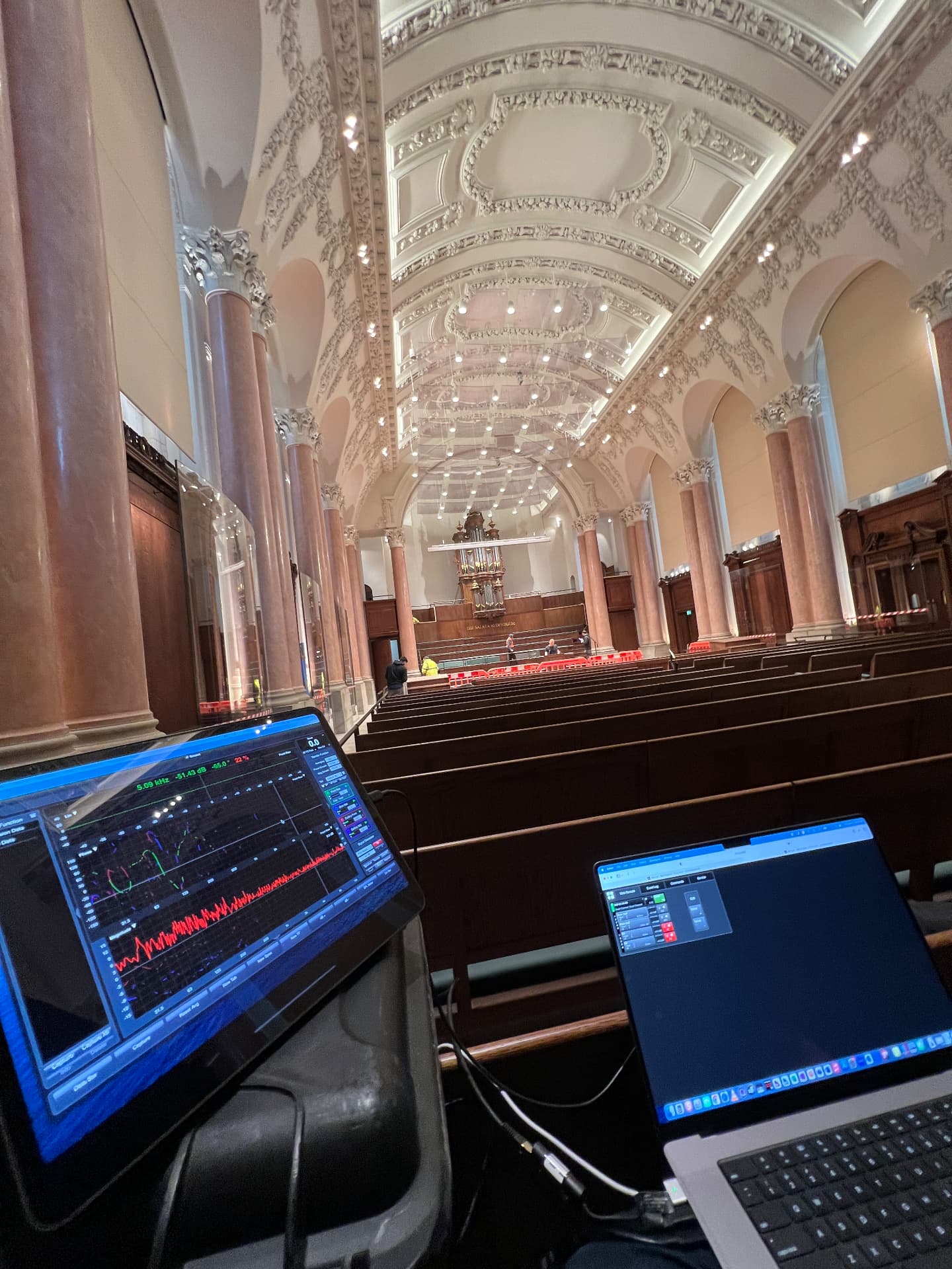 Commissioning and system tuning from the house — dual-FFT measurement in progress.