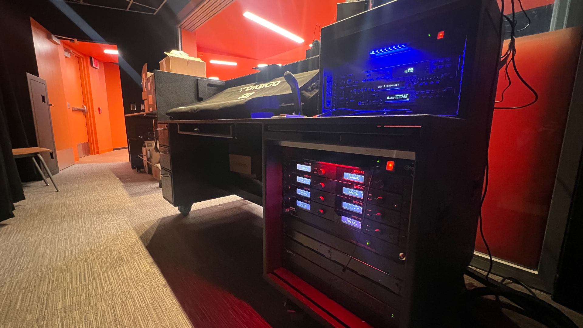 Rolling mix position: DiGiCo console, wireless microphone and in-ear racks, and monitoring.