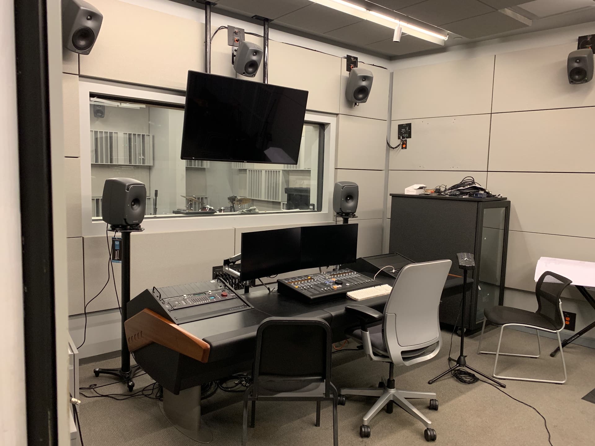 Control room with immersive monitoring and console-based mixing.