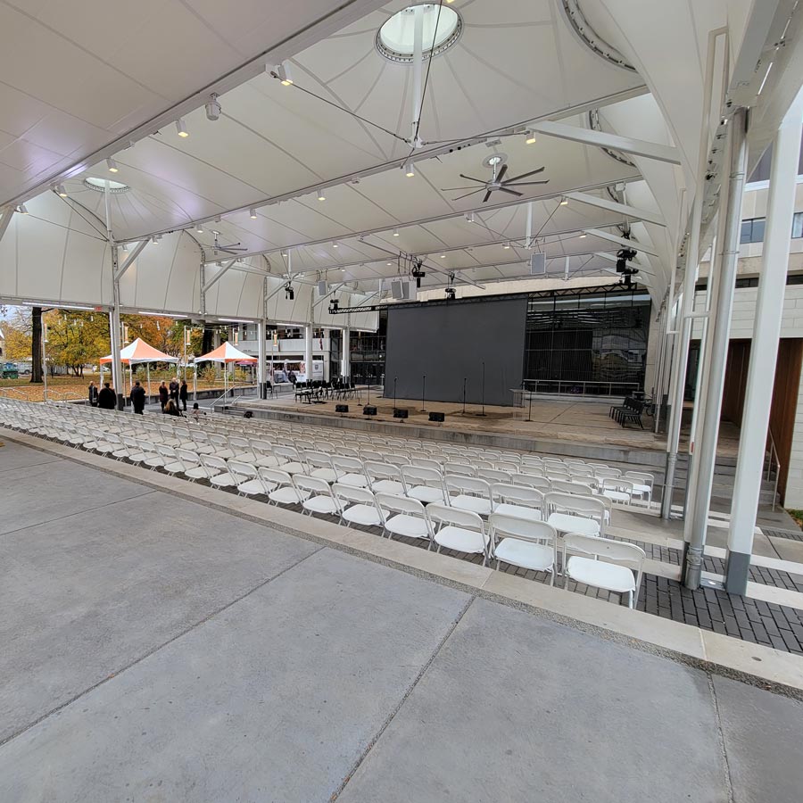 House seating and projection surface under the canopy structure.