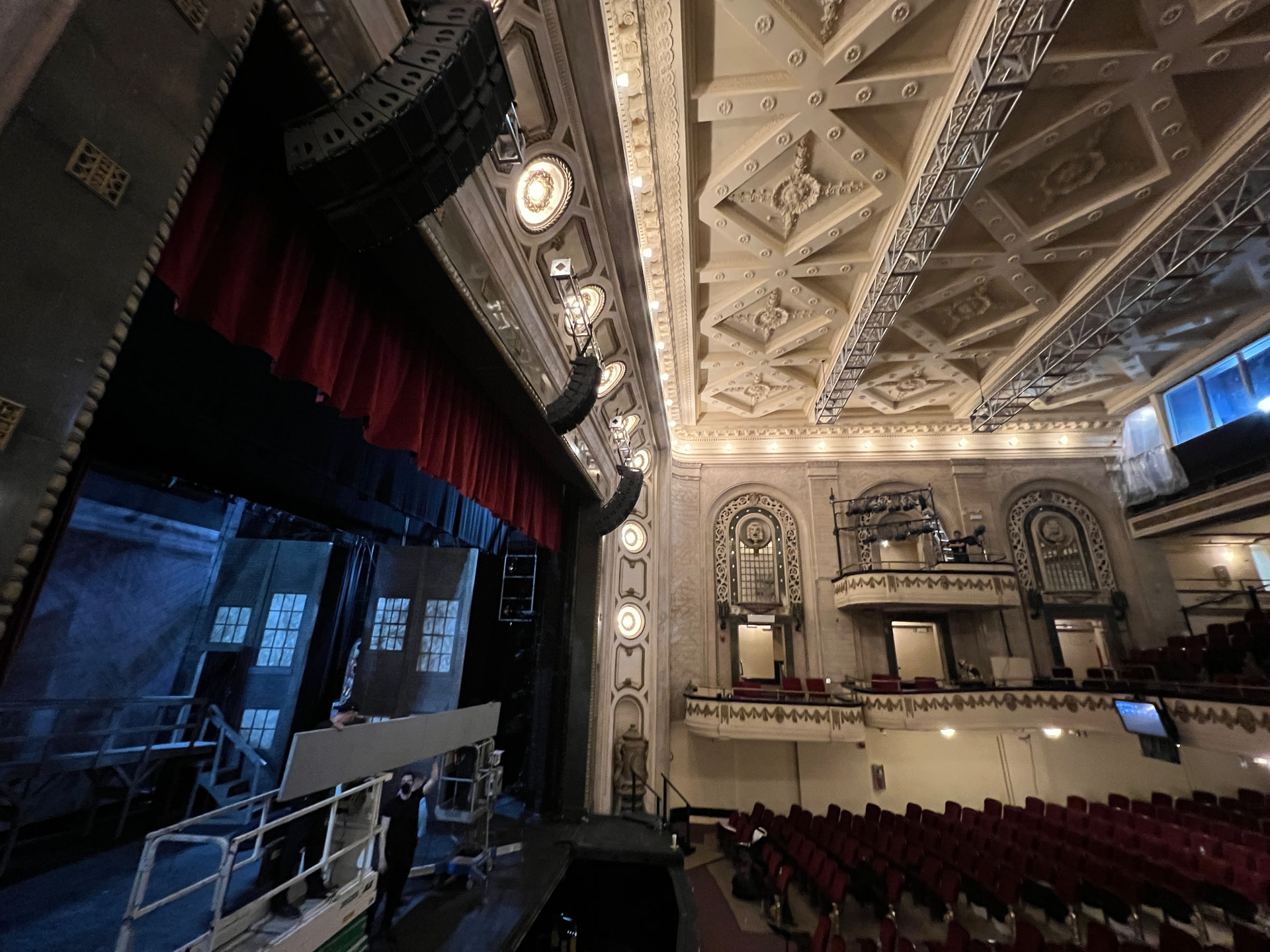 Left array and box-boom lighting positions integrated into the historic ornamental envelope.