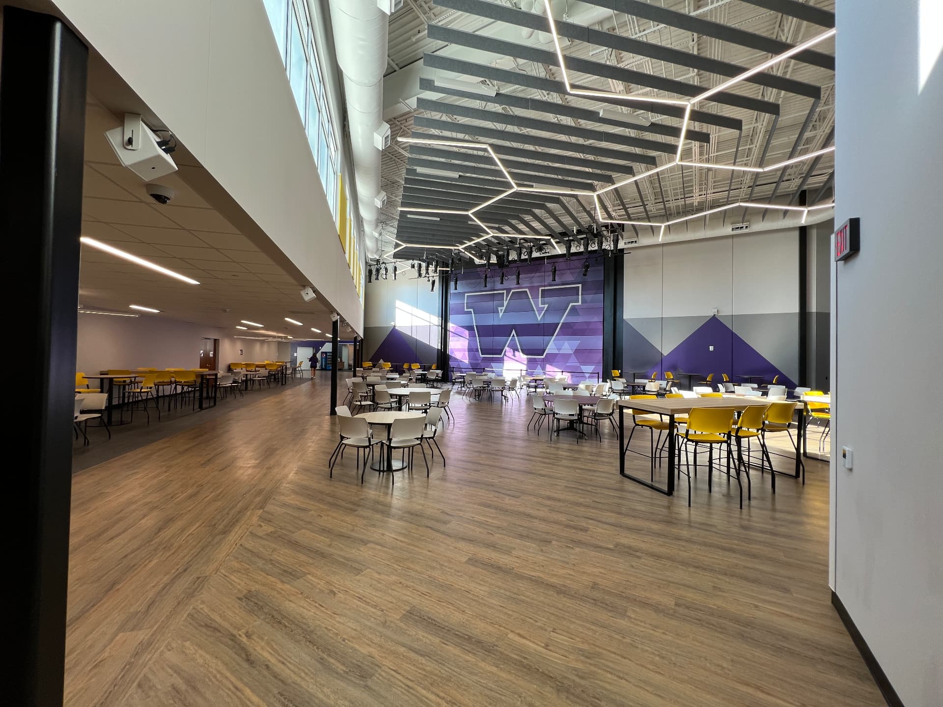 Cafeteria and commons performance zone with distributed audio and theatrical lighting.
