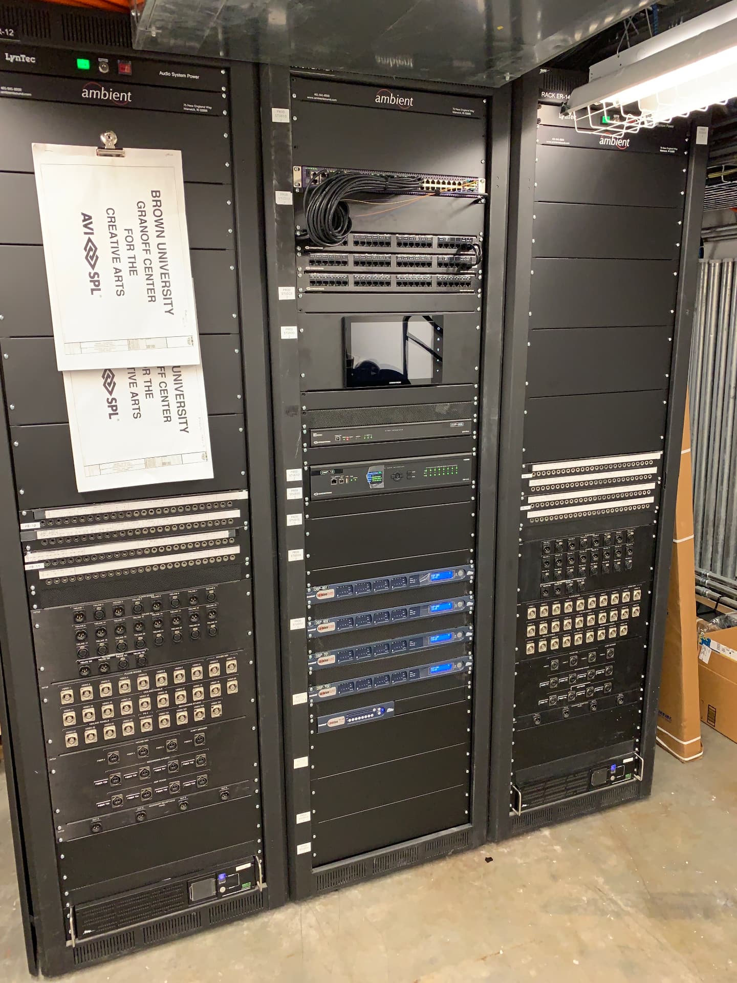 Central equipment racks — DSP, network switching, and patch for the building systems.