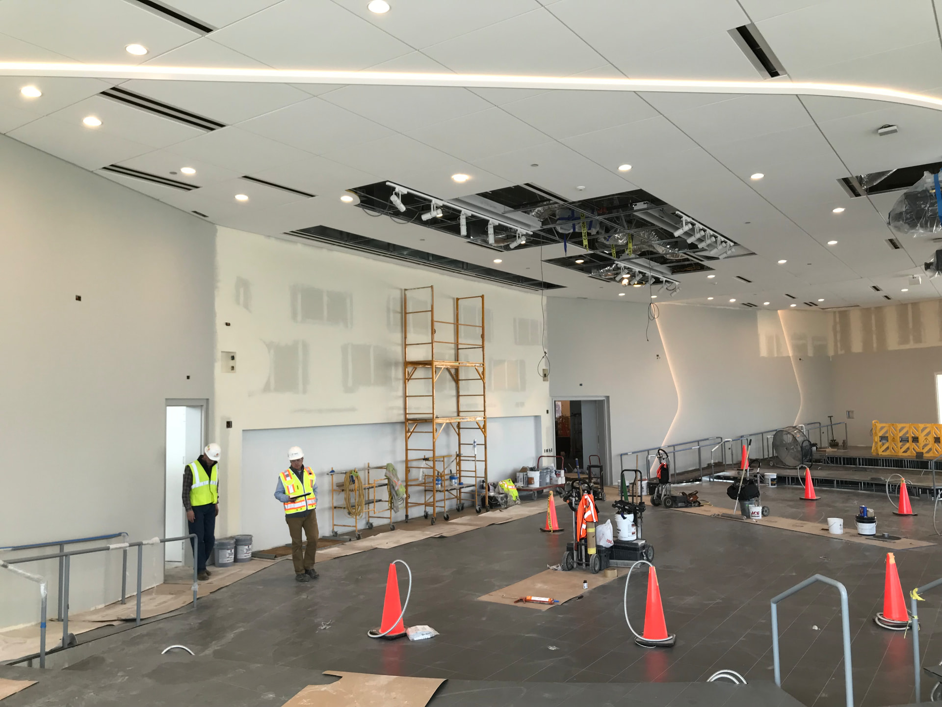 Event space under construction — AV infrastructure roughed in above the ceiling.