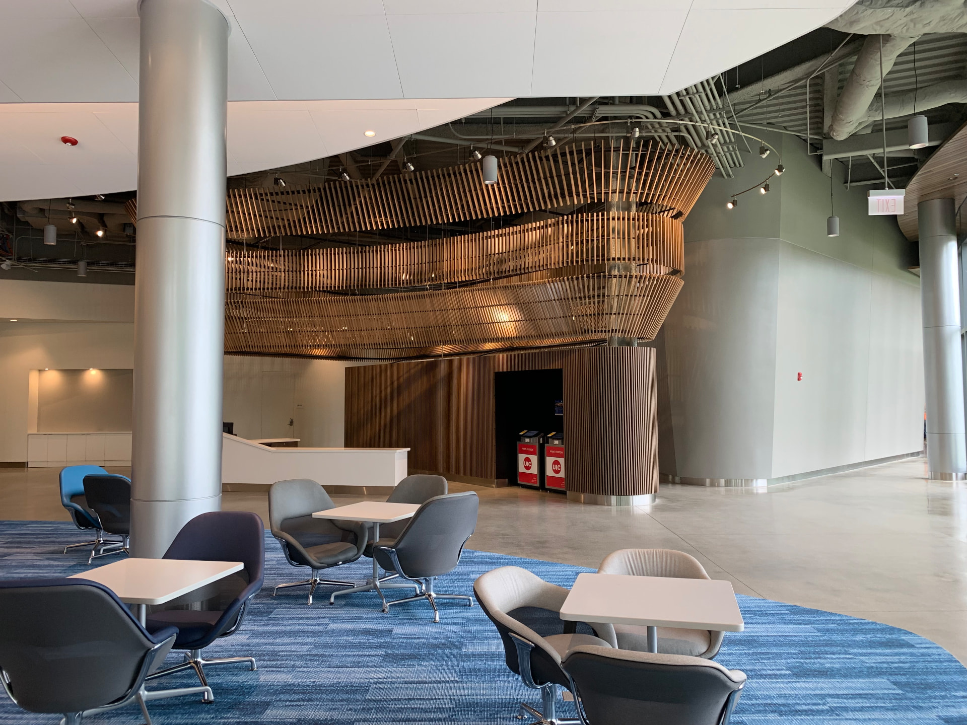 Main lobby and commons with timber canopy above the gathering space.