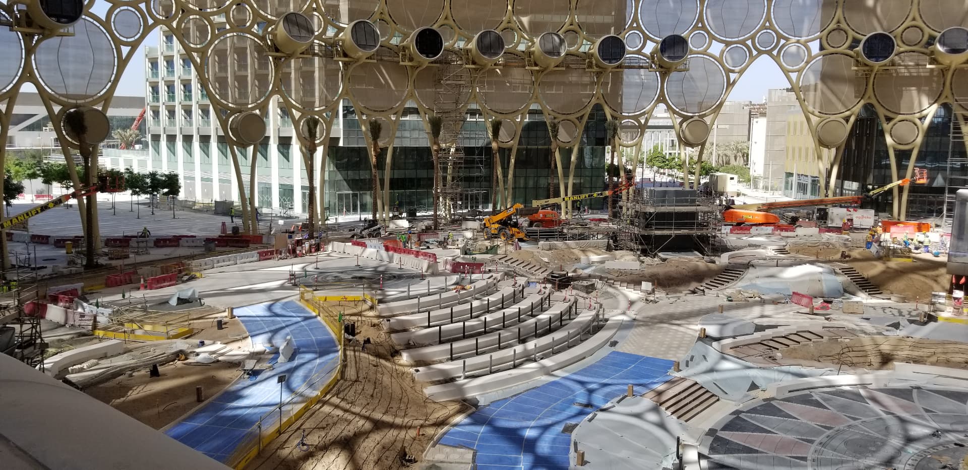Amphitheatre seating and event floor taking shape inside the plaza.