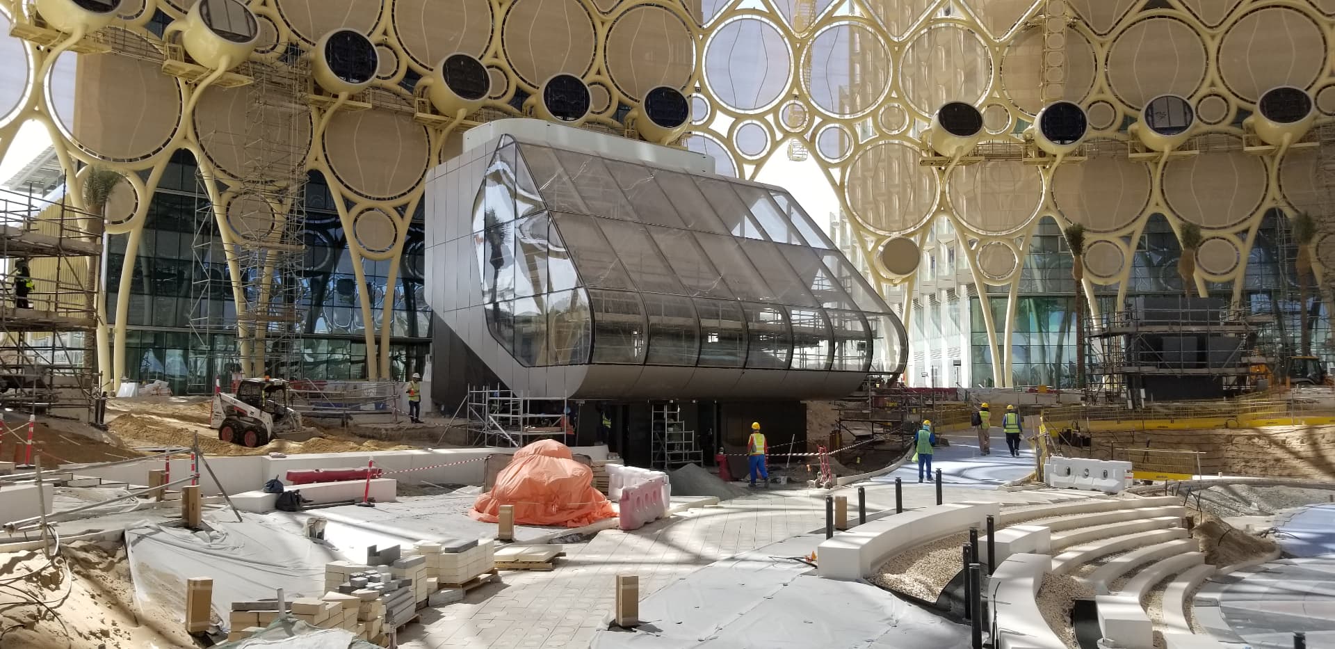 Plaza-level construction beneath the dome canopy.