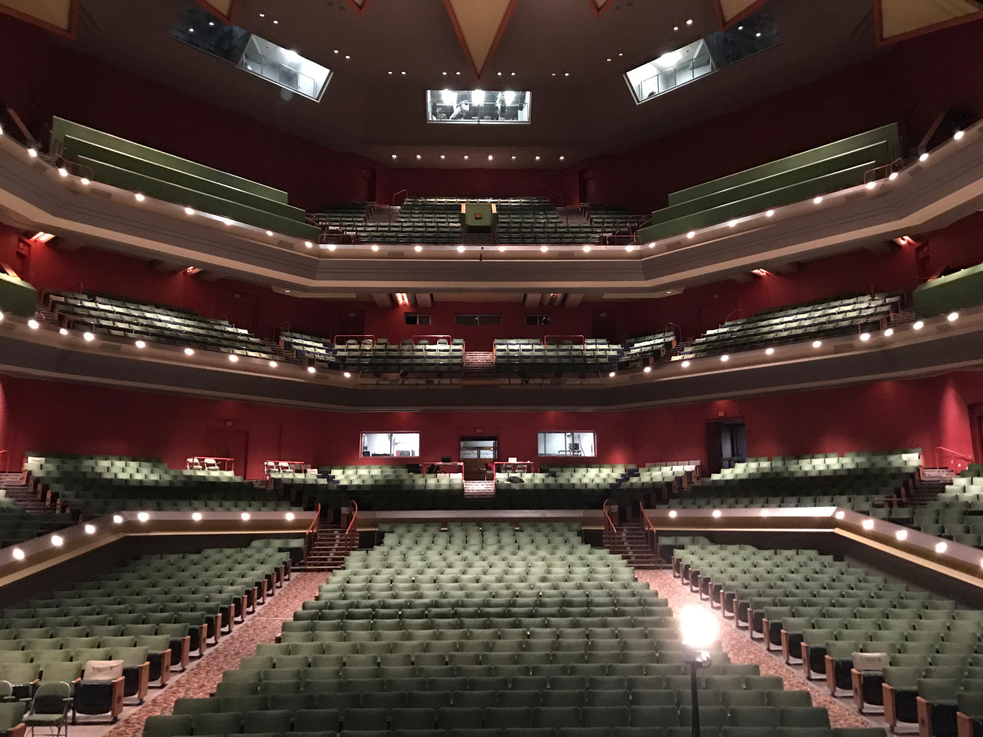 View from the stage toward the rear of house — tiered balconies used as measurement positions for the retune.